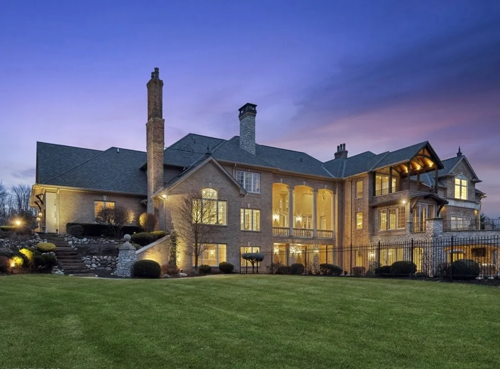 17540 Dublin Drive Home in Granger, Indiana. Experience the epitome of luxury in this magnificent 12,000+ square foot estate situated on a premier 2.65-acre lot with serene wooded views in the prestigious gated community of Shamrock Hills. Every detail of this gracious home showcases the finest materials and craftsmanship, resulting in an unparalleled living experience. Custom millwork, an elevator, and an array of exceptional features elevate this residence to the highest level of sophistication.