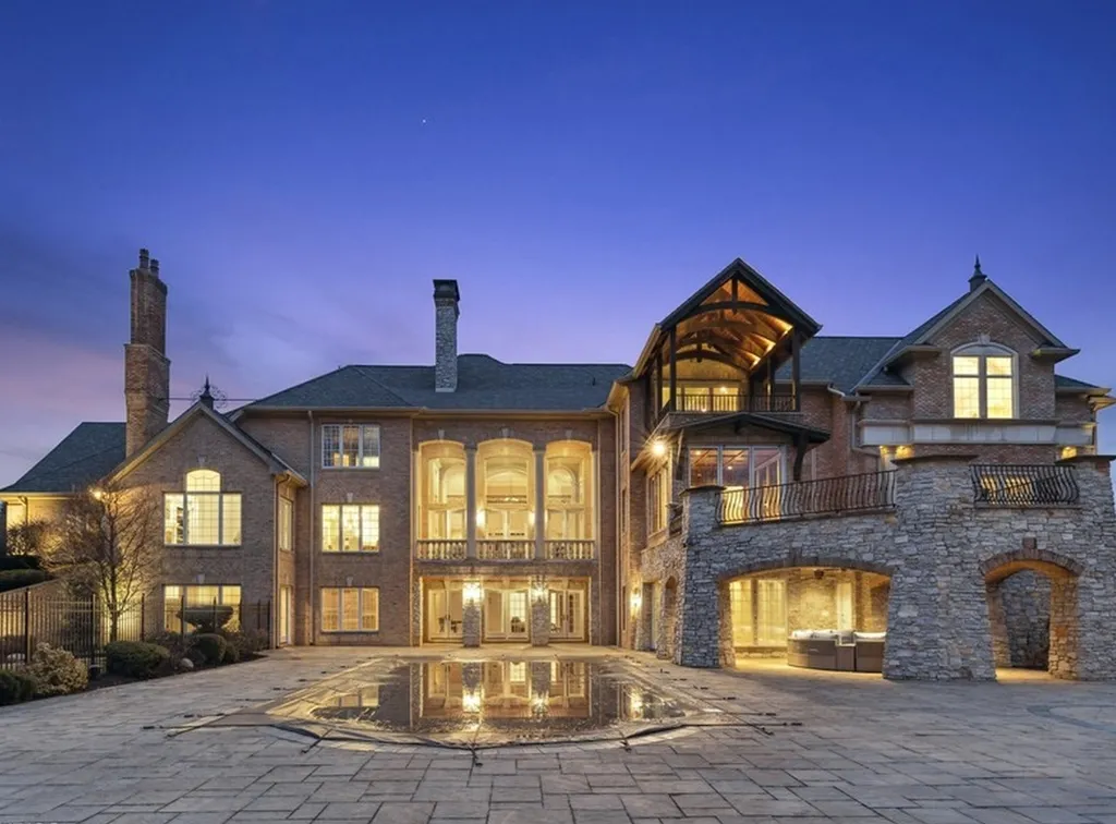17540 Dublin Drive Home in Granger, Indiana. Experience the epitome of luxury in this magnificent 12,000+ square foot estate situated on a premier 2.65-acre lot with serene wooded views in the prestigious gated community of Shamrock Hills. Every detail of this gracious home showcases the finest materials and craftsmanship, resulting in an unparalleled living experience. Custom millwork, an elevator, and an array of exceptional features elevate this residence to the highest level of sophistication.