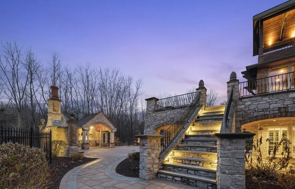 17540 Dublin Drive Home in Granger, Indiana. Experience the epitome of luxury in this magnificent 12,000+ square foot estate situated on a premier 2.65-acre lot with serene wooded views in the prestigious gated community of Shamrock Hills. Every detail of this gracious home showcases the finest materials and craftsmanship, resulting in an unparalleled living experience. Custom millwork, an elevator, and an array of exceptional features elevate this residence to the highest level of sophistication.