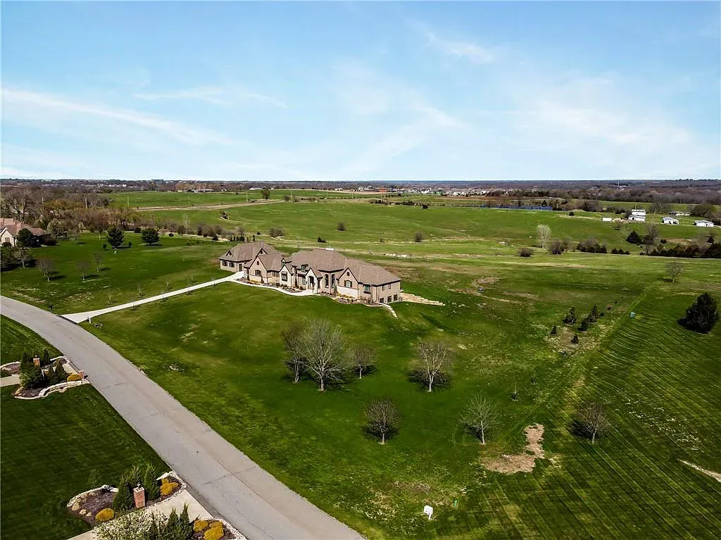 18111 Melrose Drive Home in Overland Park, Kansas. Stunning estate property situated on nearly 8 acres in the coveted Wolf Valley. With over 7600 square feet of living space and an astounding 12 garage spaces, this property offers everything you could ever need.