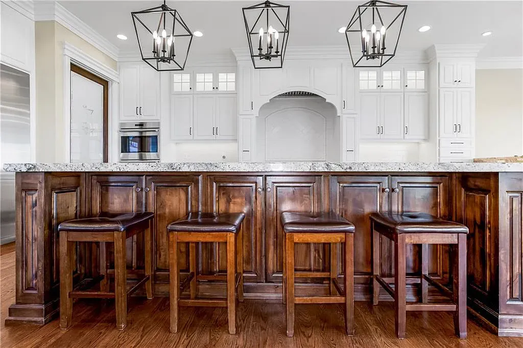 18111 Melrose Drive Home in Overland Park, Kansas. Stunning estate property situated on nearly 8 acres in the coveted Wolf Valley. With over 7600 square feet of living space and an astounding 12 garage spaces, this property offers everything you could ever need.
