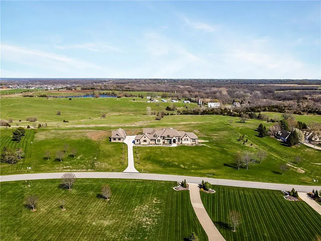 18111 Melrose Drive Home in Overland Park, Kansas. Stunning estate property situated on nearly 8 acres in the coveted Wolf Valley. With over 7600 square feet of living space and an astounding 12 garage spaces, this property offers everything you could ever need.