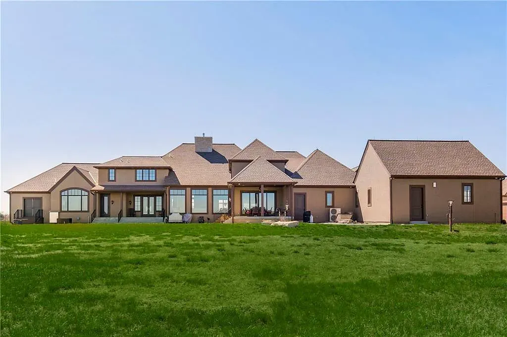 18111 Melrose Drive Home in Overland Park, Kansas. Stunning estate property situated on nearly 8 acres in the coveted Wolf Valley. With over 7600 square feet of living space and an astounding 12 garage spaces, this property offers everything you could ever need.