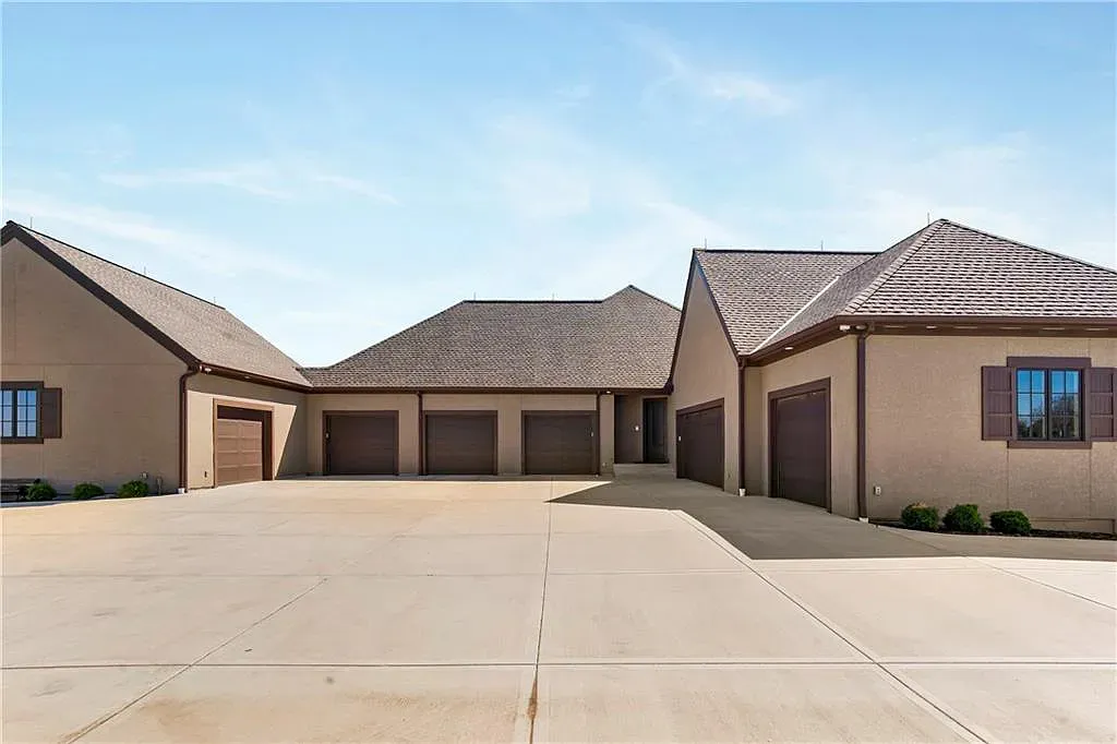 18111 Melrose Drive Home in Overland Park, Kansas. Stunning estate property situated on nearly 8 acres in the coveted Wolf Valley. With over 7600 square feet of living space and an astounding 12 garage spaces, this property offers everything you could ever need.