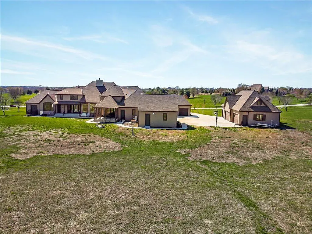 18111 Melrose Drive Home in Overland Park, Kansas. Stunning estate property situated on nearly 8 acres in the coveted Wolf Valley. With over 7600 square feet of living space and an astounding 12 garage spaces, this property offers everything you could ever need.