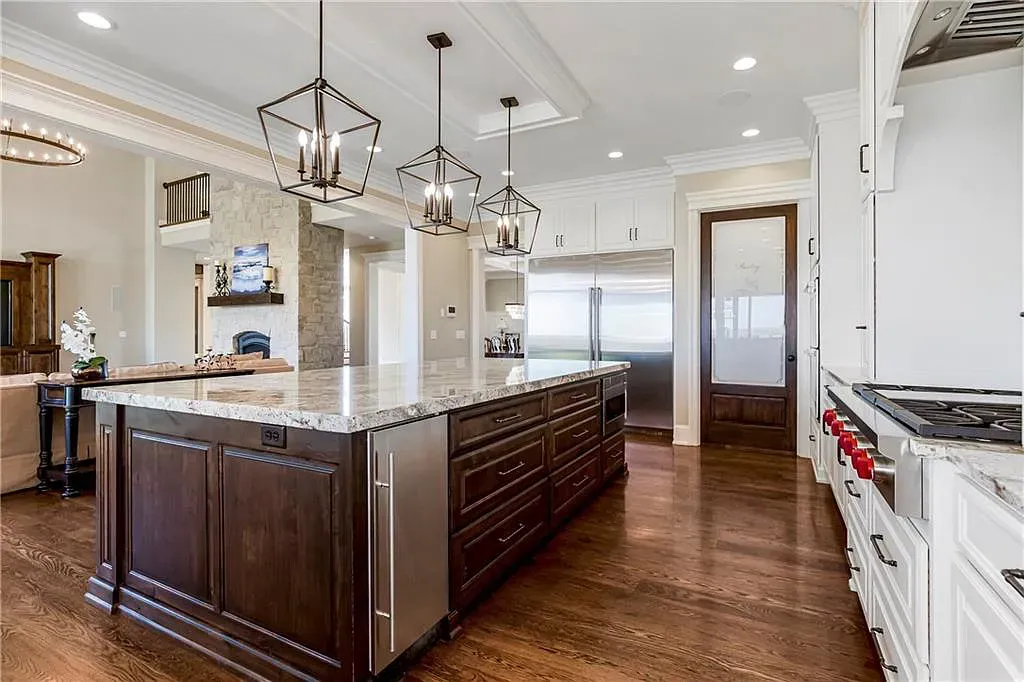 18111 Melrose Drive Home in Overland Park, Kansas. Stunning estate property situated on nearly 8 acres in the coveted Wolf Valley. With over 7600 square feet of living space and an astounding 12 garage spaces, this property offers everything you could ever need.