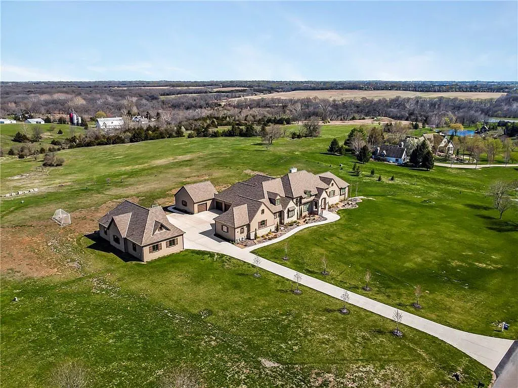 18111 Melrose Drive Home in Overland Park, Kansas. Stunning estate property situated on nearly 8 acres in the coveted Wolf Valley. With over 7600 square feet of living space and an astounding 12 garage spaces, this property offers everything you could ever need.