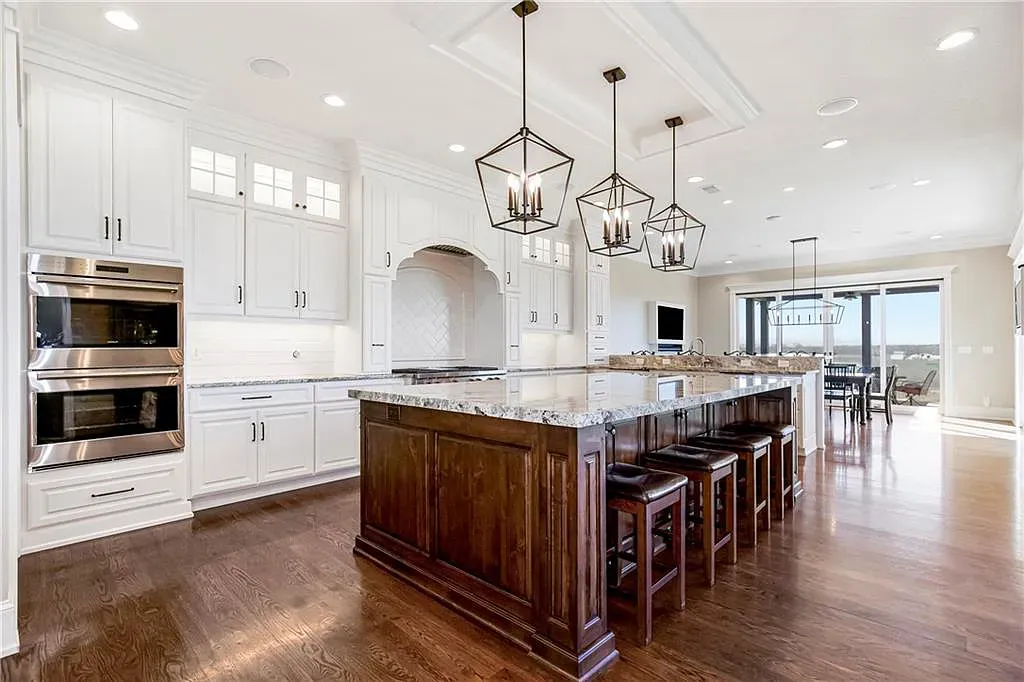 18111 Melrose Drive Home in Overland Park, Kansas. Stunning estate property situated on nearly 8 acres in the coveted Wolf Valley. With over 7600 square feet of living space and an astounding 12 garage spaces, this property offers everything you could ever need.