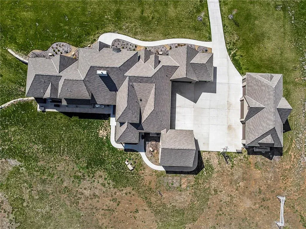 18111 Melrose Drive Home in Overland Park, Kansas. Stunning estate property situated on nearly 8 acres in the coveted Wolf Valley. With over 7600 square feet of living space and an astounding 12 garage spaces, this property offers everything you could ever need.