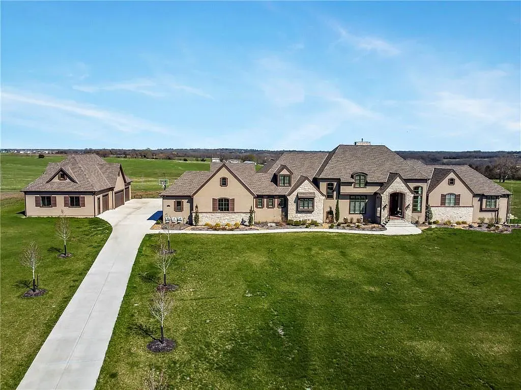 18111 Melrose Drive Home in Overland Park, Kansas. Stunning estate property situated on nearly 8 acres in the coveted Wolf Valley. With over 7600 square feet of living space and an astounding 12 garage spaces, this property offers everything you could ever need.