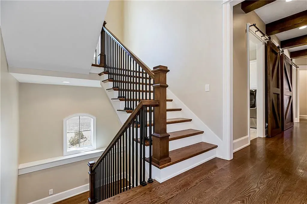 18111 Melrose Drive Home in Overland Park, Kansas. Stunning estate property situated on nearly 8 acres in the coveted Wolf Valley. With over 7600 square feet of living space and an astounding 12 garage spaces, this property offers everything you could ever need.