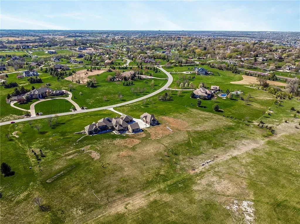 18111 Melrose Drive Home in Overland Park, Kansas. Stunning estate property situated on nearly 8 acres in the coveted Wolf Valley. With over 7600 square feet of living space and an astounding 12 garage spaces, this property offers everything you could ever need.