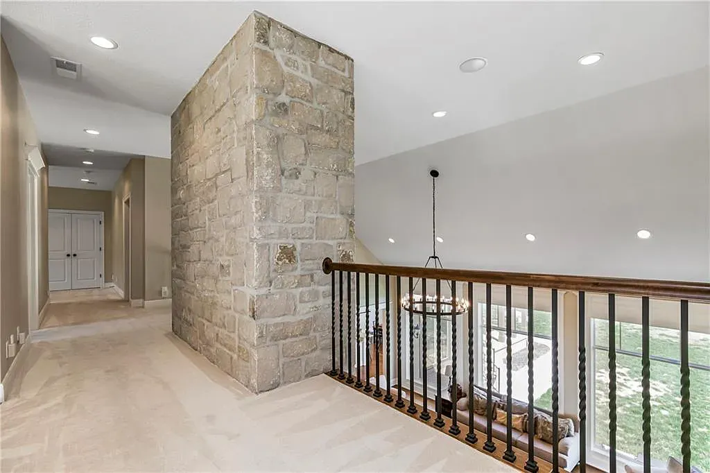 18111 Melrose Drive Home in Overland Park, Kansas. Stunning estate property situated on nearly 8 acres in the coveted Wolf Valley. With over 7600 square feet of living space and an astounding 12 garage spaces, this property offers everything you could ever need.