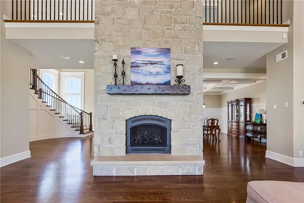 18111 Melrose Drive Home in Overland Park, Kansas. Stunning estate property situated on nearly 8 acres in the coveted Wolf Valley. With over 7600 square feet of living space and an astounding 12 garage spaces, this property offers everything you could ever need.