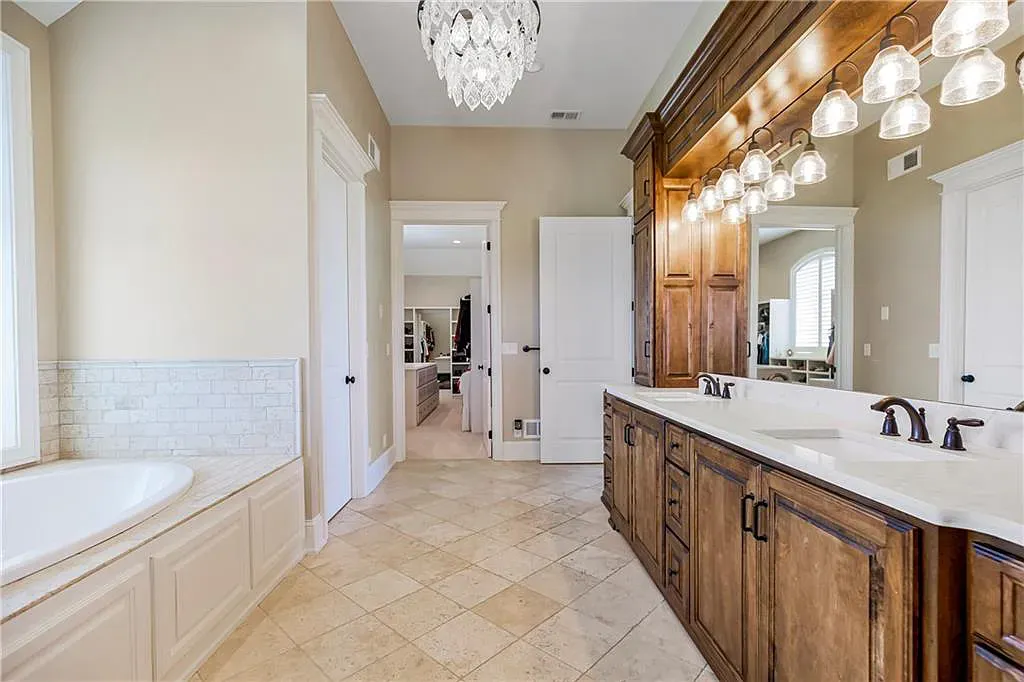 18111 Melrose Drive Home in Overland Park, Kansas. Stunning estate property situated on nearly 8 acres in the coveted Wolf Valley. With over 7600 square feet of living space and an astounding 12 garage spaces, this property offers everything you could ever need.