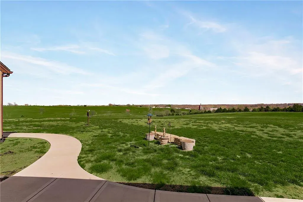 18111 Melrose Drive Home in Overland Park, Kansas. Stunning estate property situated on nearly 8 acres in the coveted Wolf Valley. With over 7600 square feet of living space and an astounding 12 garage spaces, this property offers everything you could ever need.