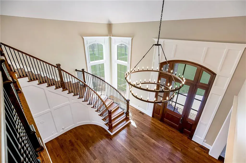 18111 Melrose Drive Home in Overland Park, Kansas. Stunning estate property situated on nearly 8 acres in the coveted Wolf Valley. With over 7600 square feet of living space and an astounding 12 garage spaces, this property offers everything you could ever need.