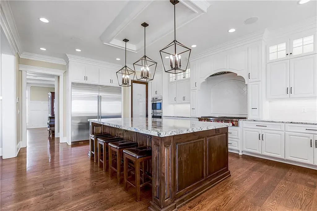 18111 Melrose Drive Home in Overland Park, Kansas. Stunning estate property situated on nearly 8 acres in the coveted Wolf Valley. With over 7600 square feet of living space and an astounding 12 garage spaces, this property offers everything you could ever need.