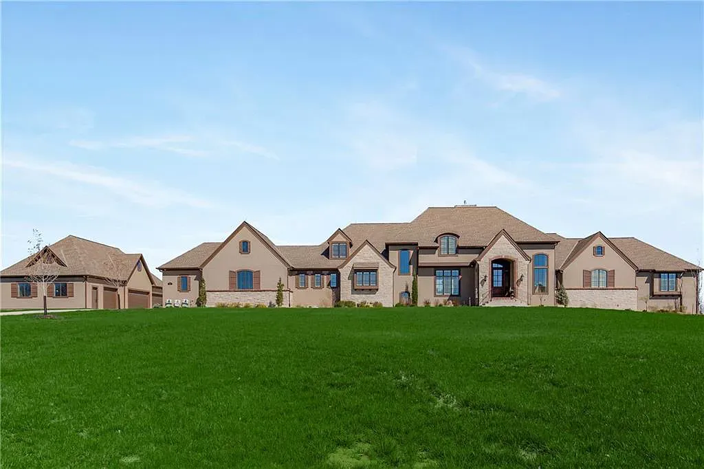 18111 Melrose Drive Home in Overland Park, Kansas. Stunning estate property situated on nearly 8 acres in the coveted Wolf Valley. With over 7600 square feet of living space and an astounding 12 garage spaces, this property offers everything you could ever need.