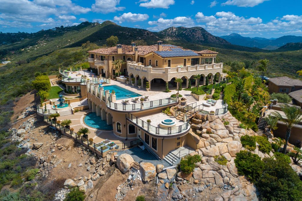 1903 Saxton Lane Home in El Cajon, California. Discover unparalleled luxury living in this custom-built, handcrafted mountaintop estate with unobstructed views. Designed by renowned architect John Jensen AIA and built by Tony Mezain AME Proline Inc, this 13,631 sqft retreat features 5 bedrooms, 9 bathrooms, and exquisite attention to detail. 