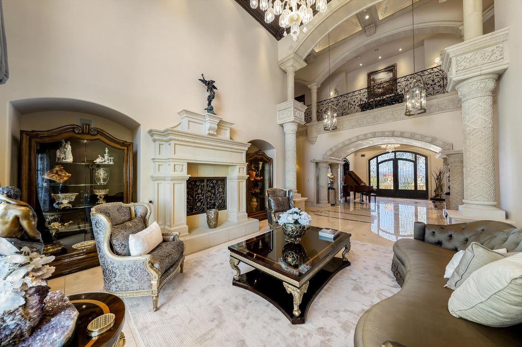 1903 Saxton Lane Home in El Cajon, California. Discover unparalleled luxury living in this custom-built, handcrafted mountaintop estate with unobstructed views. Designed by renowned architect John Jensen AIA and built by Tony Mezain AME Proline Inc, this 13,631 sqft retreat features 5 bedrooms, 9 bathrooms, and exquisite attention to detail. 