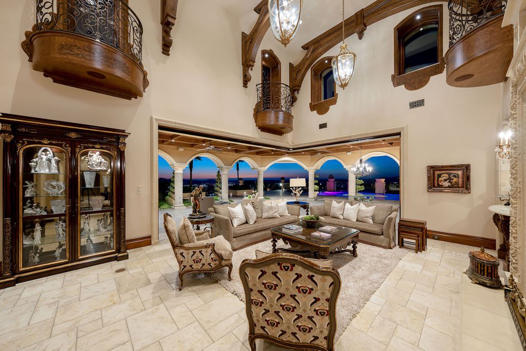 1903 Saxton Lane Home in El Cajon, California. Discover unparalleled luxury living in this custom-built, handcrafted mountaintop estate with unobstructed views. Designed by renowned architect John Jensen AIA and built by Tony Mezain AME Proline Inc, this 13,631 sqft retreat features 5 bedrooms, 9 bathrooms, and exquisite attention to detail. 