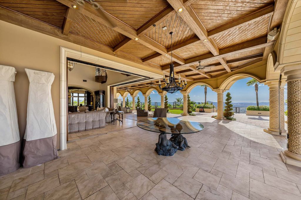 1903 Saxton Lane Home in El Cajon, California. Discover unparalleled luxury living in this custom-built, handcrafted mountaintop estate with unobstructed views. Designed by renowned architect John Jensen AIA and built by Tony Mezain AME Proline Inc, this 13,631 sqft retreat features 5 bedrooms, 9 bathrooms, and exquisite attention to detail. 
