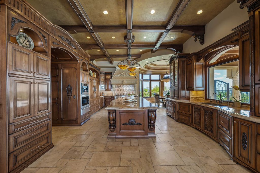 1903 Saxton Lane Home in El Cajon, California. Discover unparalleled luxury living in this custom-built, handcrafted mountaintop estate with unobstructed views. Designed by renowned architect John Jensen AIA and built by Tony Mezain AME Proline Inc, this 13,631 sqft retreat features 5 bedrooms, 9 bathrooms, and exquisite attention to detail. 