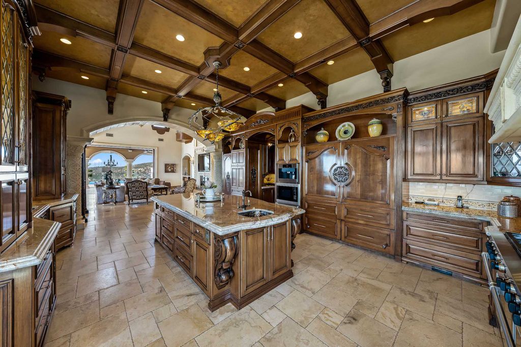 1903 Saxton Lane Home in El Cajon, California. Discover unparalleled luxury living in this custom-built, handcrafted mountaintop estate with unobstructed views. Designed by renowned architect John Jensen AIA and built by Tony Mezain AME Proline Inc, this 13,631 sqft retreat features 5 bedrooms, 9 bathrooms, and exquisite attention to detail. 