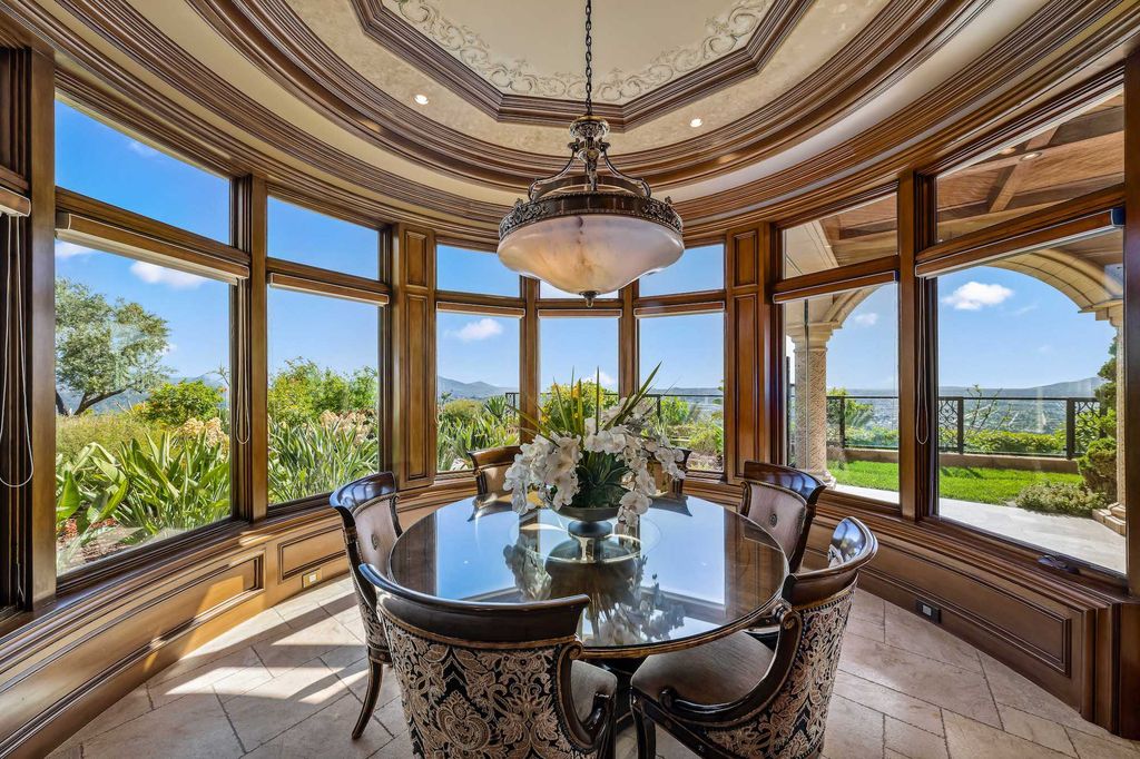 1903 Saxton Lane Home in El Cajon, California. Discover unparalleled luxury living in this custom-built, handcrafted mountaintop estate with unobstructed views. Designed by renowned architect John Jensen AIA and built by Tony Mezain AME Proline Inc, this 13,631 sqft retreat features 5 bedrooms, 9 bathrooms, and exquisite attention to detail. 