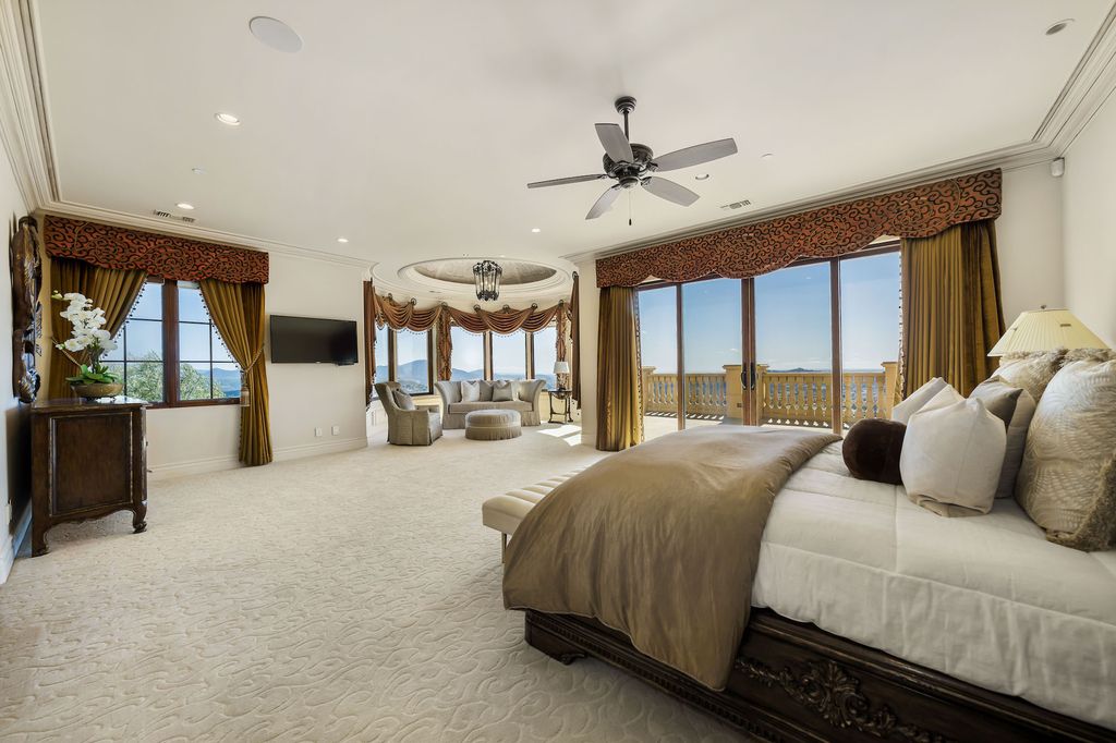 1903 Saxton Lane Home in El Cajon, California. Discover unparalleled luxury living in this custom-built, handcrafted mountaintop estate with unobstructed views. Designed by renowned architect John Jensen AIA and built by Tony Mezain AME Proline Inc, this 13,631 sqft retreat features 5 bedrooms, 9 bathrooms, and exquisite attention to detail. 