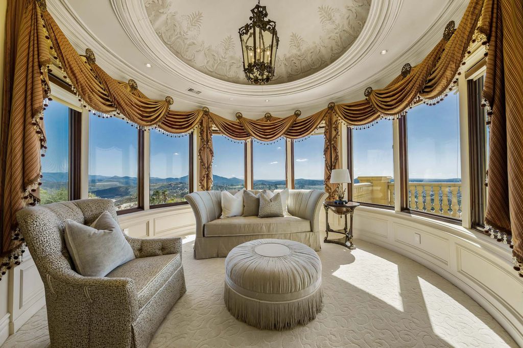 1903 Saxton Lane Home in El Cajon, California. Discover unparalleled luxury living in this custom-built, handcrafted mountaintop estate with unobstructed views. Designed by renowned architect John Jensen AIA and built by Tony Mezain AME Proline Inc, this 13,631 sqft retreat features 5 bedrooms, 9 bathrooms, and exquisite attention to detail. 