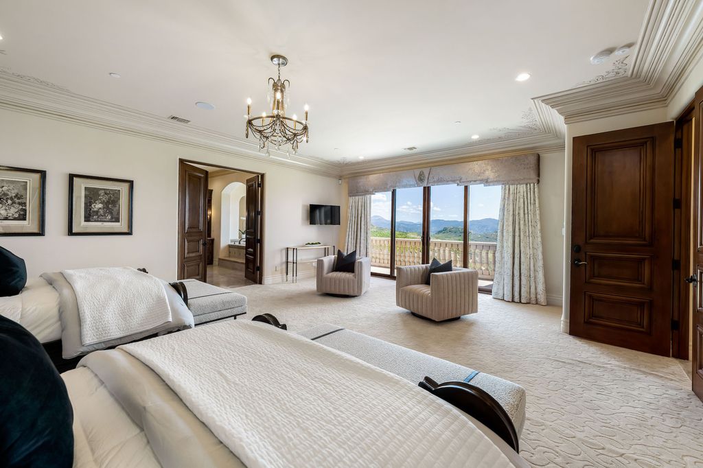 1903 Saxton Lane Home in El Cajon, California. Discover unparalleled luxury living in this custom-built, handcrafted mountaintop estate with unobstructed views. Designed by renowned architect John Jensen AIA and built by Tony Mezain AME Proline Inc, this 13,631 sqft retreat features 5 bedrooms, 9 bathrooms, and exquisite attention to detail. 