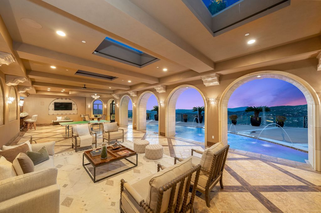 1903 Saxton Lane Home in El Cajon, California. Discover unparalleled luxury living in this custom-built, handcrafted mountaintop estate with unobstructed views. Designed by renowned architect John Jensen AIA and built by Tony Mezain AME Proline Inc, this 13,631 sqft retreat features 5 bedrooms, 9 bathrooms, and exquisite attention to detail. 
