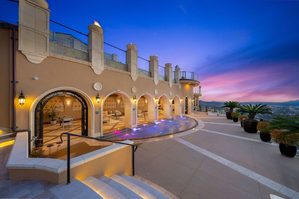 1903 Saxton Lane Home in El Cajon, California. Discover unparalleled luxury living in this custom-built, handcrafted mountaintop estate with unobstructed views. Designed by renowned architect John Jensen AIA and built by Tony Mezain AME Proline Inc, this 13,631 sqft retreat features 5 bedrooms, 9 bathrooms, and exquisite attention to detail. 