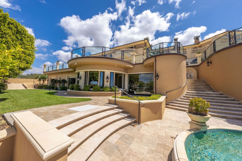 1903 Saxton Lane Home in El Cajon, California. Discover unparalleled luxury living in this custom-built, handcrafted mountaintop estate with unobstructed views. Designed by renowned architect John Jensen AIA and built by Tony Mezain AME Proline Inc, this 13,631 sqft retreat features 5 bedrooms, 9 bathrooms, and exquisite attention to detail. 