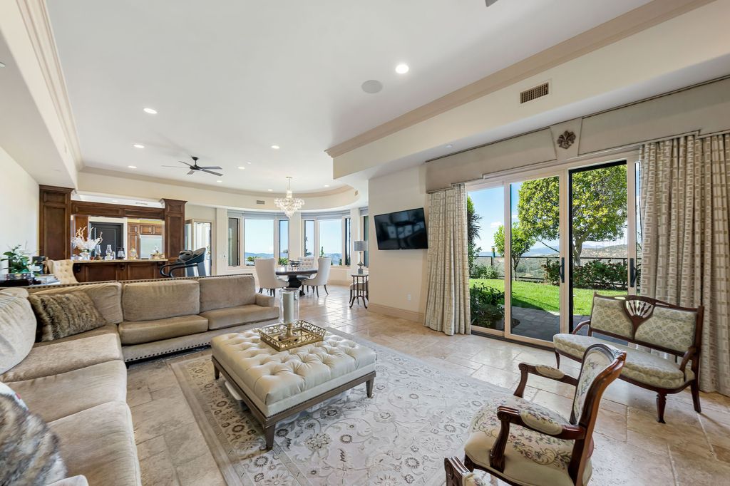 1903 Saxton Lane Home in El Cajon, California. Discover unparalleled luxury living in this custom-built, handcrafted mountaintop estate with unobstructed views. Designed by renowned architect John Jensen AIA and built by Tony Mezain AME Proline Inc, this 13,631 sqft retreat features 5 bedrooms, 9 bathrooms, and exquisite attention to detail. 