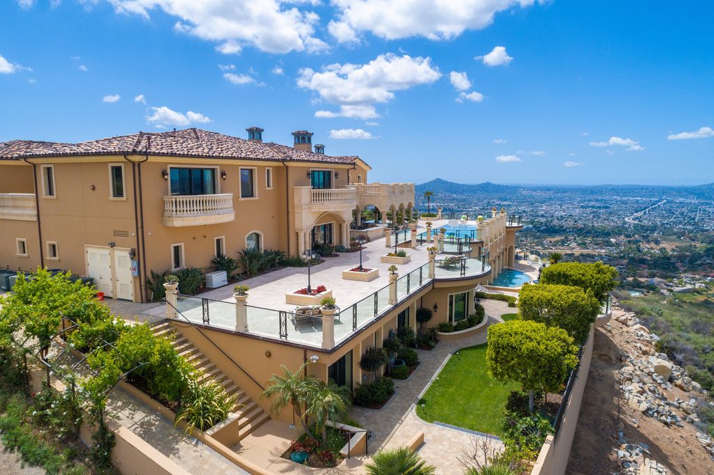 1903 Saxton Lane Home in El Cajon, California. Discover unparalleled luxury living in this custom-built, handcrafted mountaintop estate with unobstructed views. Designed by renowned architect John Jensen AIA and built by Tony Mezain AME Proline Inc, this 13,631 sqft retreat features 5 bedrooms, 9 bathrooms, and exquisite attention to detail. 
