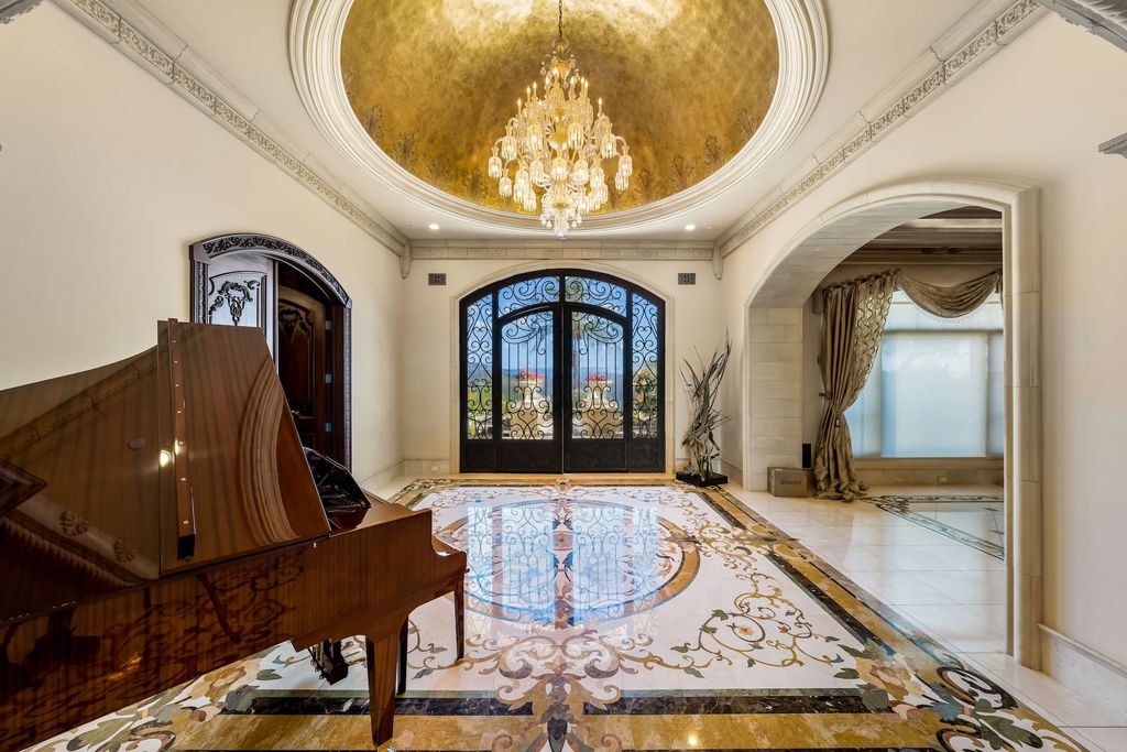 1903 Saxton Lane Home in El Cajon, California. Discover unparalleled luxury living in this custom-built, handcrafted mountaintop estate with unobstructed views. Designed by renowned architect John Jensen AIA and built by Tony Mezain AME Proline Inc, this 13,631 sqft retreat features 5 bedrooms, 9 bathrooms, and exquisite attention to detail. 