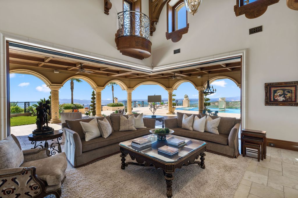 1903 Saxton Lane Home in El Cajon, California. Discover unparalleled luxury living in this custom-built, handcrafted mountaintop estate with unobstructed views. Designed by renowned architect John Jensen AIA and built by Tony Mezain AME Proline Inc, this 13,631 sqft retreat features 5 bedrooms, 9 bathrooms, and exquisite attention to detail. 