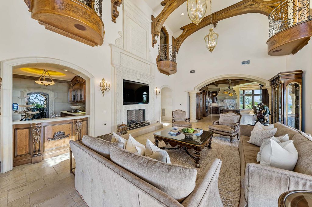 1903 Saxton Lane Home in El Cajon, California. Discover unparalleled luxury living in this custom-built, handcrafted mountaintop estate with unobstructed views. Designed by renowned architect John Jensen AIA and built by Tony Mezain AME Proline Inc, this 13,631 sqft retreat features 5 bedrooms, 9 bathrooms, and exquisite attention to detail. 