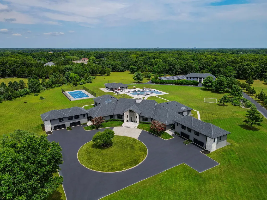 1980 Campbell Road Home in Wall, New Jersey. Experience the epitome of luxury living at Mattaccino, a remarkable 23.44 acre residential resort that surpasses all expectations. Discover a sprawling 32,500 square-foot compound, featuring an impressive array of amenities, including 10+ bedrooms, 17 bathrooms, a four-hole golf course, equestrian stables, an ultra-chic underground nightclub, and an indoor pool and spa.