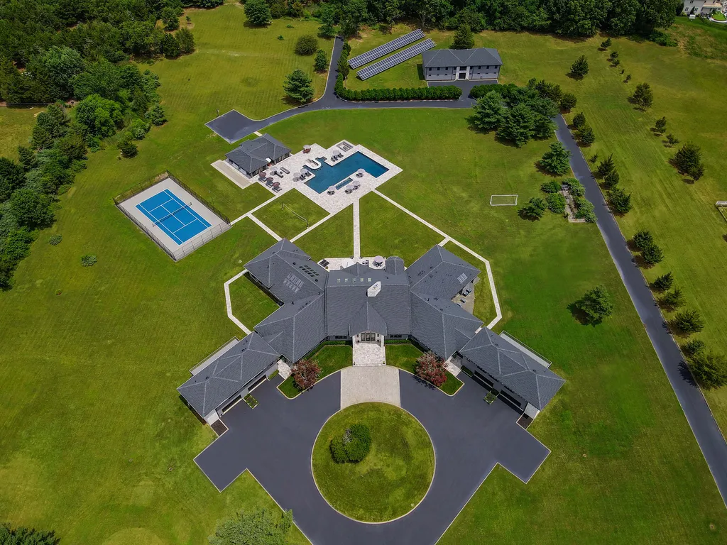 1980 Campbell Road Home in Wall, New Jersey. Experience the epitome of luxury living at Mattaccino, a remarkable 23.44 acre residential resort that surpasses all expectations. Discover a sprawling 32,500 square-foot compound, featuring an impressive array of amenities, including 10+ bedrooms, 17 bathrooms, a four-hole golf course, equestrian stables, an ultra-chic underground nightclub, and an indoor pool and spa.