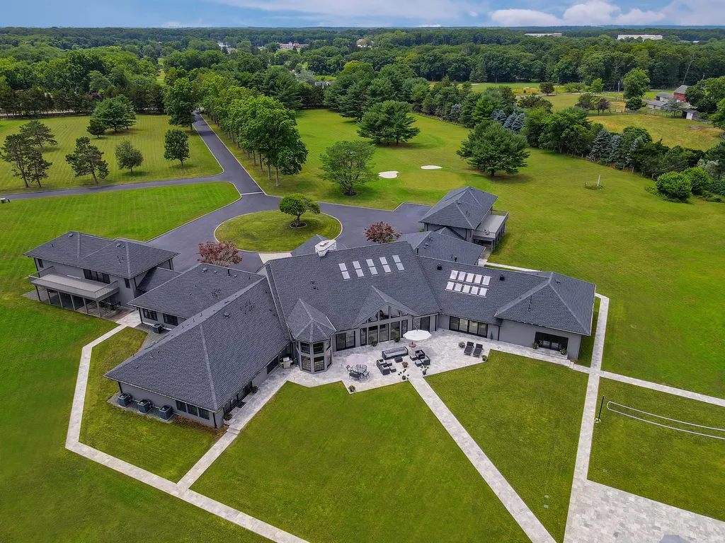 1980 Campbell Road Home in Wall, New Jersey. Experience the epitome of luxury living at Mattaccino, a remarkable 23.44 acre residential resort that surpasses all expectations. Discover a sprawling 32,500 square-foot compound, featuring an impressive array of amenities, including 10+ bedrooms, 17 bathrooms, a four-hole golf course, equestrian stables, an ultra-chic underground nightclub, and an indoor pool and spa.
