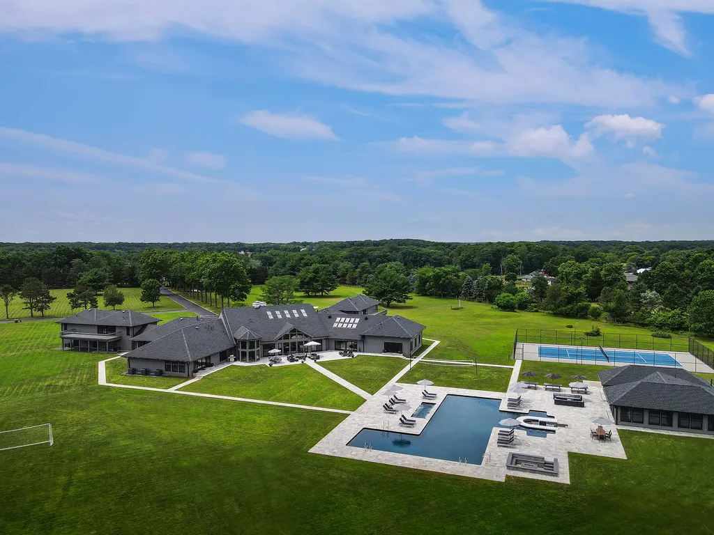 1980 Campbell Road Home in Wall, New Jersey. Experience the epitome of luxury living at Mattaccino, a remarkable 23.44 acre residential resort that surpasses all expectations. Discover a sprawling 32,500 square-foot compound, featuring an impressive array of amenities, including 10+ bedrooms, 17 bathrooms, a four-hole golf course, equestrian stables, an ultra-chic underground nightclub, and an indoor pool and spa.