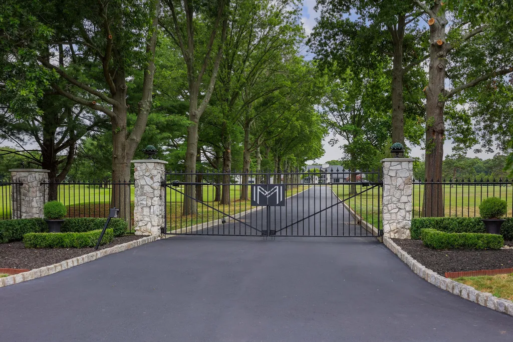 1980 Campbell Road Home in Wall, New Jersey. Experience the epitome of luxury living at Mattaccino, a remarkable 23.44 acre residential resort that surpasses all expectations. Discover a sprawling 32,500 square-foot compound, featuring an impressive array of amenities, including 10+ bedrooms, 17 bathrooms, a four-hole golf course, equestrian stables, an ultra-chic underground nightclub, and an indoor pool and spa.