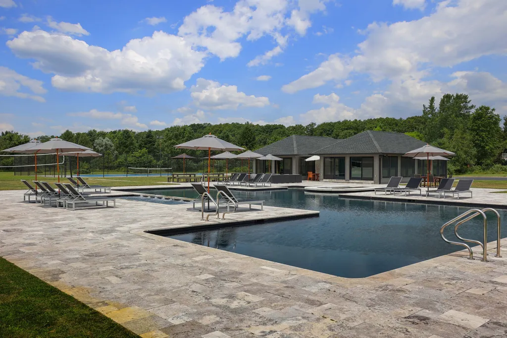 1980 Campbell Road Home in Wall, New Jersey. Experience the epitome of luxury living at Mattaccino, a remarkable 23.44 acre residential resort that surpasses all expectations. Discover a sprawling 32,500 square-foot compound, featuring an impressive array of amenities, including 10+ bedrooms, 17 bathrooms, a four-hole golf course, equestrian stables, an ultra-chic underground nightclub, and an indoor pool and spa.