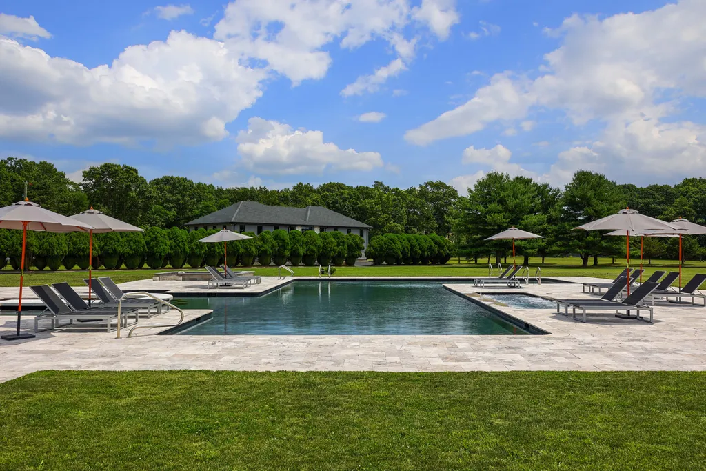 1980 Campbell Road Home in Wall, New Jersey. Experience the epitome of luxury living at Mattaccino, a remarkable 23.44 acre residential resort that surpasses all expectations. Discover a sprawling 32,500 square-foot compound, featuring an impressive array of amenities, including 10+ bedrooms, 17 bathrooms, a four-hole golf course, equestrian stables, an ultra-chic underground nightclub, and an indoor pool and spa.