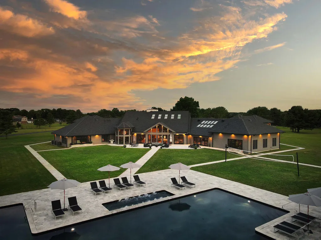 1980 Campbell Road Home in Wall, New Jersey. Experience the epitome of luxury living at Mattaccino, a remarkable 23.44 acre residential resort that surpasses all expectations. Discover a sprawling 32,500 square-foot compound, featuring an impressive array of amenities, including 10+ bedrooms, 17 bathrooms, a four-hole golf course, equestrian stables, an ultra-chic underground nightclub, and an indoor pool and spa.