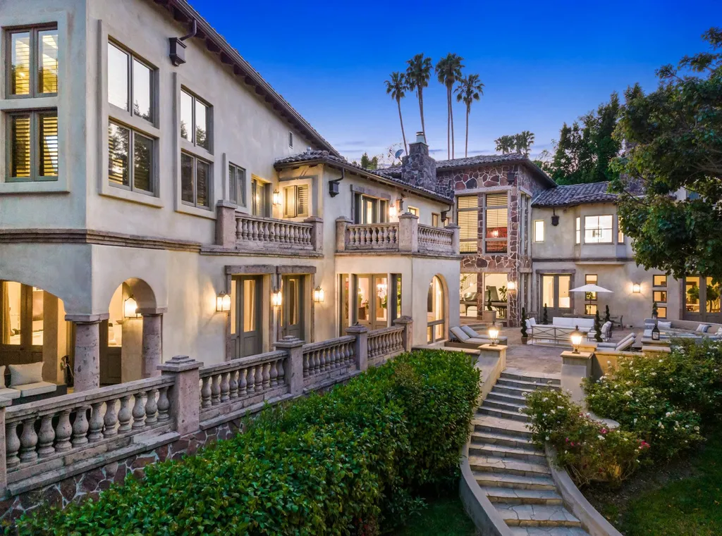 206 N Carolwood Drive Home in Los Angeles, California. Experience the epitome of luxurious living in this contemporary Tuscany-style estate nestled on the prestigious Carolwood Drive in prime Holmby Hills. Beyond the private gated entrance, this magnificent 10-bedroom, 10-bathroom residence awaits, surrounded by towering trees and lushly landscaped verdant grounds. Built with natural woods and imported stone, the home's romantic exterior seamlessly blends with the tranquil beauty of its surroundings.